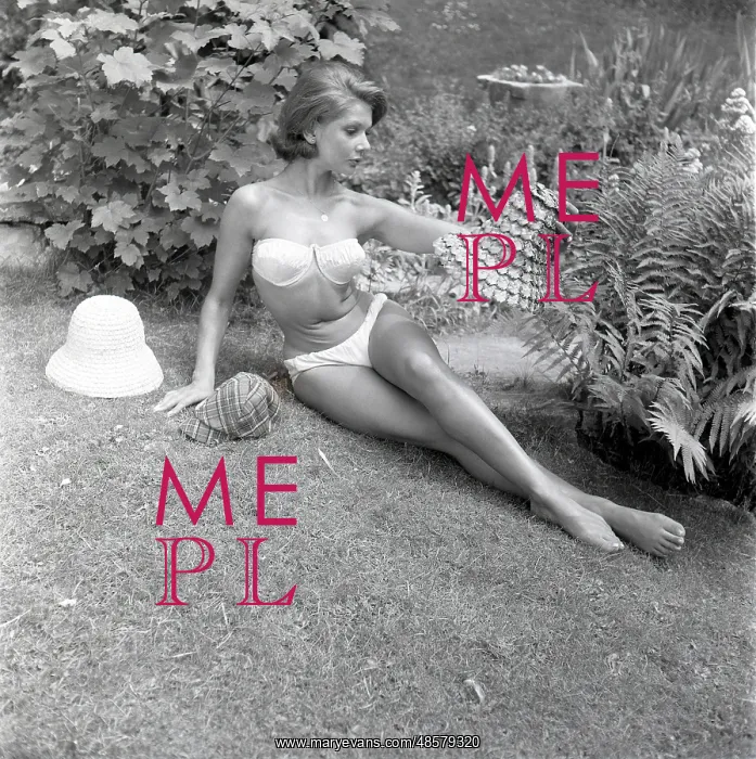 : Model sunbathing in a white bikini : Model sunbathing in a white bikini