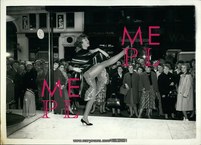 : Model Susan performs in shop window, Glasgow, Scotland : Model Susan performs in shop window, Glasgow, Scotland