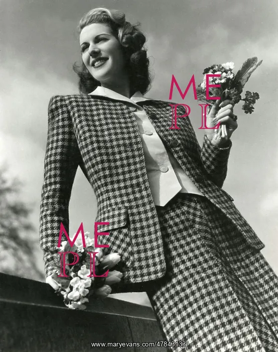 : Model wearing a check two-piece wool suit with posies : Model wearing a check two-piece wool suit with posies