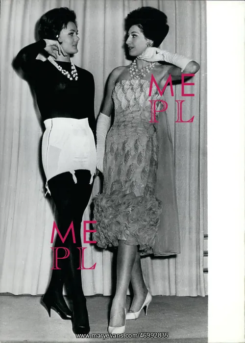  : Two models, one with corset on display