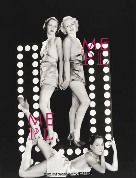 : Three models posing by large letter U : Three models posing by large letter U