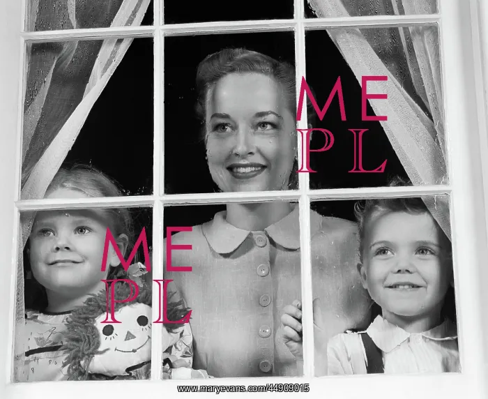 : Mom with two kids looking out window towards : Mom with two kids looking out window towards