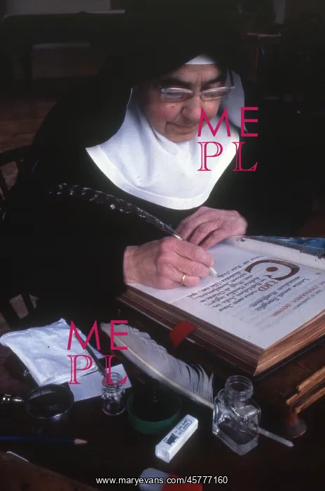 : Monastic life - nun inscribing religious texts : Monastic life - nun inscribing religious texts