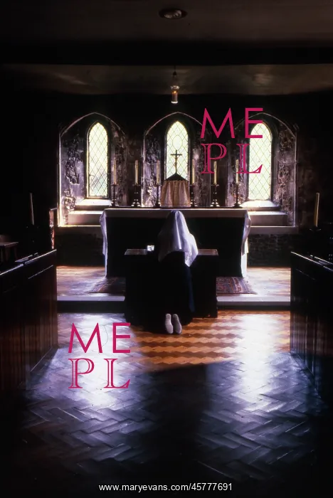 : Monastic life - nun kneeling in prayer at the altar : Monastic life - nun kneeling in prayer at the altar