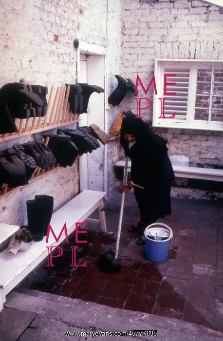 : Monastic life - nun mopping yard : Monastic life - nun mopping yard