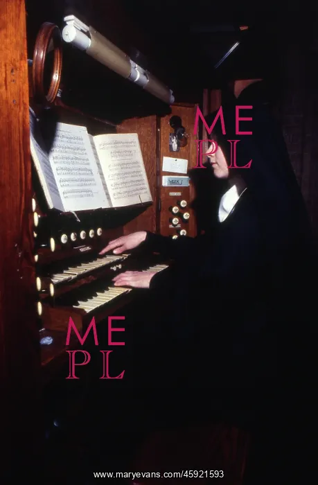 : Monastic life - nun playing the organ : Monastic life - nun playing the organ