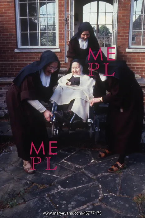 : Monastic life - nuns caring for elderly member of convent : Monastic life - nuns caring for elderly member of convent