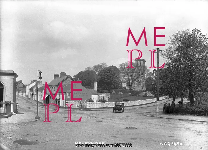 : Moneymore - a view of a crossroads with a motor car on the road : Moneymore - a view of a crossroads with a motor car on the road