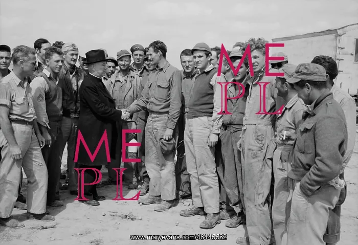 : Monsignor Spellman shaking hands with Corporal : Monsignor Spellman shaking hands with Corporal