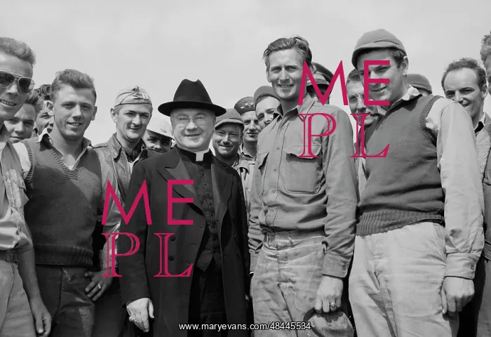 : Monsignor Spellman shaking hands with Corporal : Monsignor Spellman shaking hands with Corporal