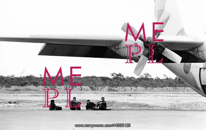 : Moroccan officers relax under the wings of their : Moroccan officers relax under the wings of their