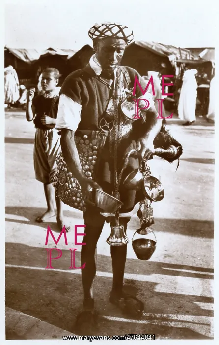 : Moroccan water carrier with containers and bell : Moroccan water carrier with containers and bell
