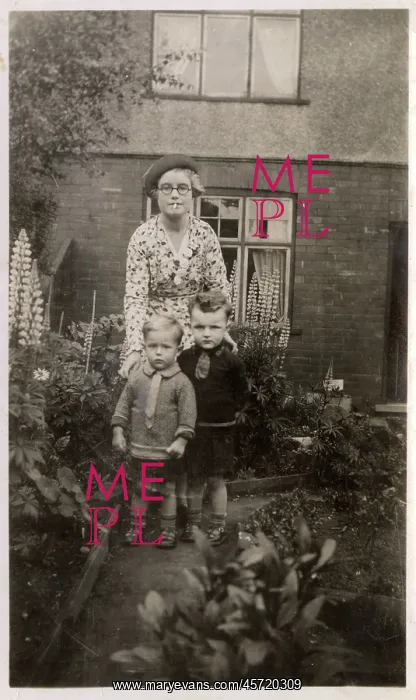 : Mother and her two boys in the garden : Mother and her two boys in the garden