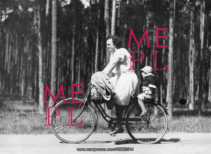 : Mother with child on bicycle, 1932 : Mother with child on bicycle, 1932