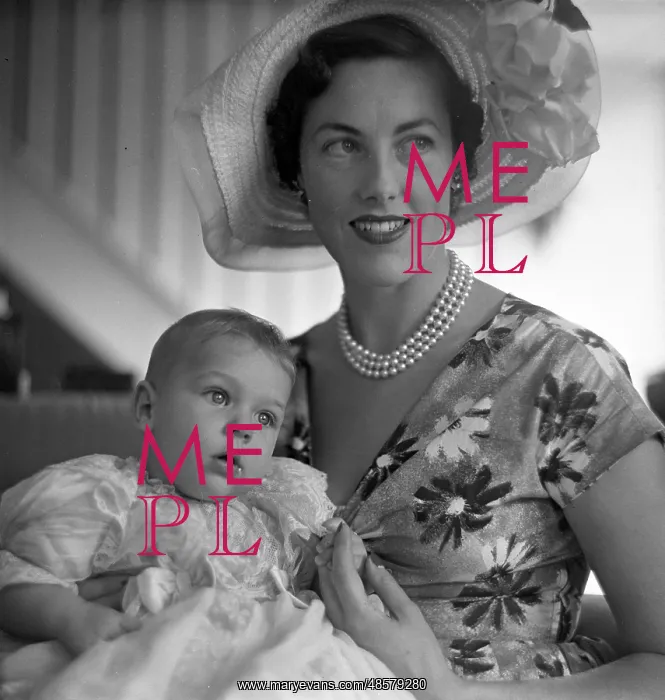 : Mother and child after a christening : Mother and child after a christening