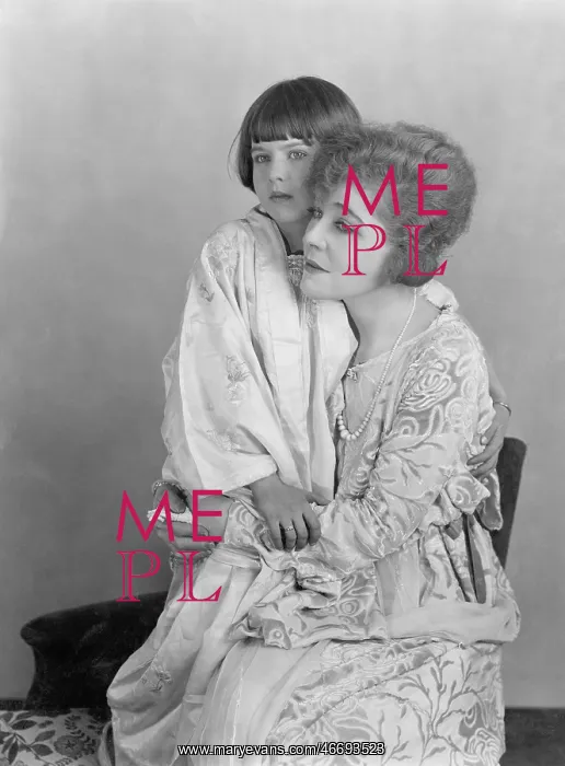 : Mother and child sitting together on a chair : Mother and child sitting together on a chair