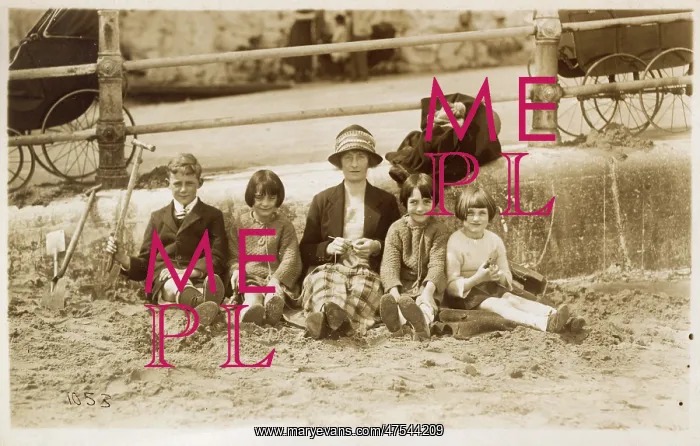 : Mother and four children on the beach : Mother and four children on the beach