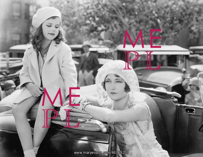: Mother and daughter standing together next to a car : Mother and daughter standing together next to a car