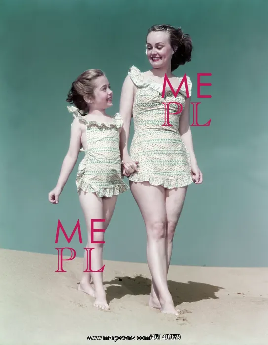 : Mother and Daughter Walk Along Beach : Mother and Daughter Walk Along Beach