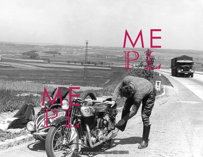 : Motorcycle breakdown next to a highway, 1939 : Motorcycle breakdown next to a highway, 1939
