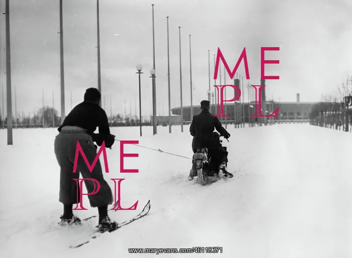 : A motorcycle rider pulling a skier : A motorcycle rider pulling a skier