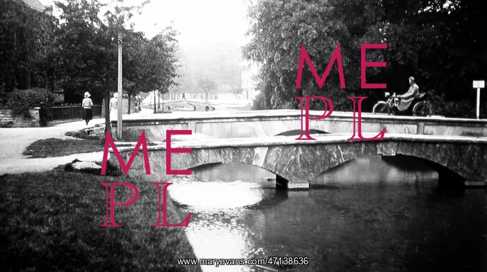 : Motorcyclist on a bridge in Bourton on the Water : Motorcyclist on a bridge in Bourton on the Water