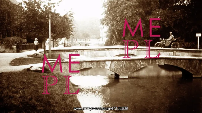 : Motorcyclist on a bridge in Bourton on the Water : Motorcyclist on a bridge in Bourton on the Water