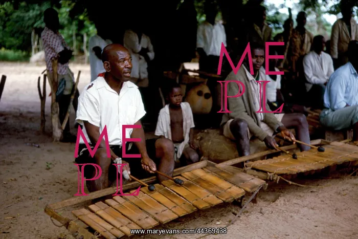  : Mshini clowning at the Chopi xylophone while playing
