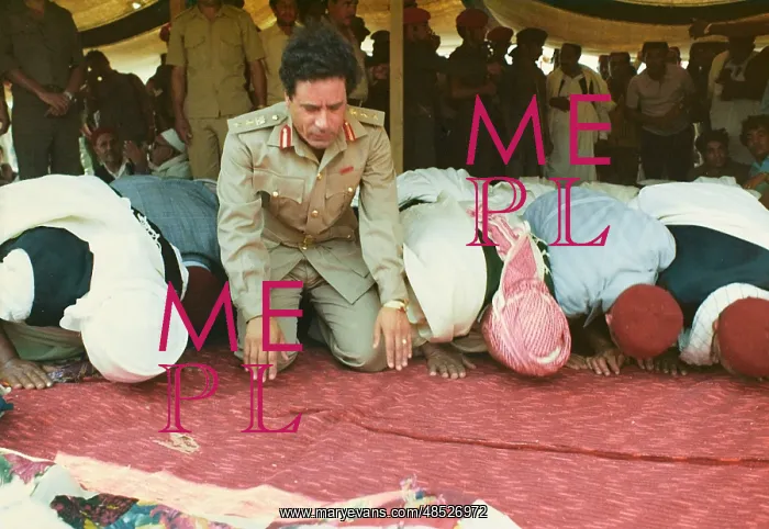 : Muammar Gaddafi and Men praying - Sousa, Libya : Muammar Gaddafi and Men praying - Sousa, Libya
