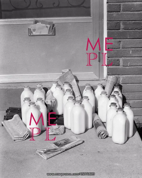 : Multiple Glass Bottles of Milk and Newspapers : Multiple Glass Bottles of Milk and Newspapers