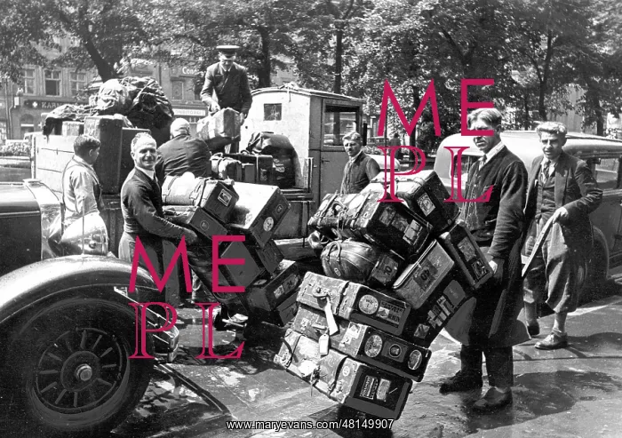 : Munich. Hotel porter of the Bayerischer Hof with suitcases and bags : Munich. Hotel porter of the Bayerischer Hof with suitcases and bags