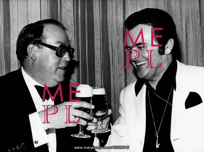: Musician Max Greger toasting with a friend : Musician Max Greger toasting with a friend