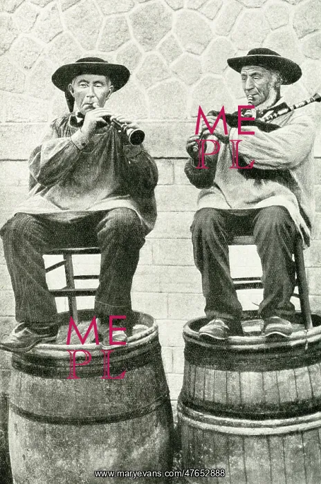 : Musicians seated on barrels, Brittany, Northern France : Musicians seated on barrels, Brittany, Northern France