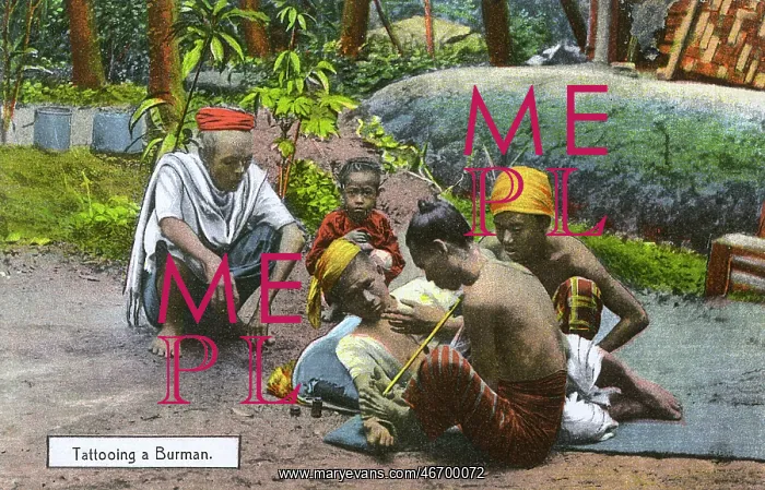 : Myanmar - A man has his arm tattooed : Myanmar - A man has his arm tattooed