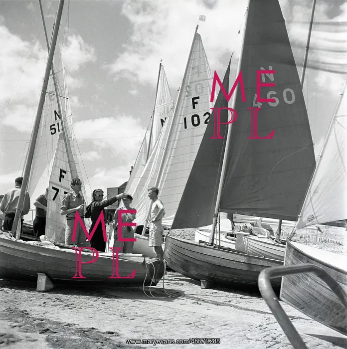 : National 12 sailing dinghies on a Devon beach : National 12 sailing dinghies on a Devon beach