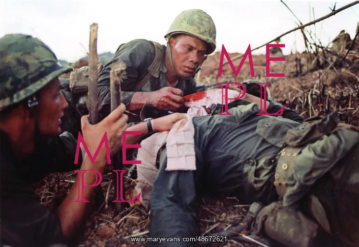 : Navy corpsman provides medical support for a wounded : Navy corpsman provides medical support for a wounded
