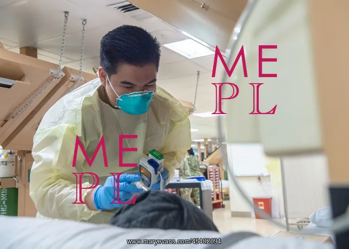 : Navy Seaman Luis Librando prepares to take a patient's : Navy Seaman Luis Librando prepares to take a patient's