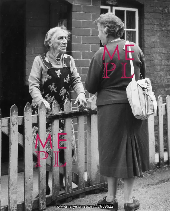  : Two neighbours chatting over a fence