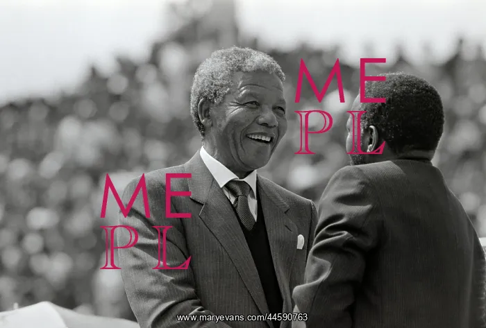 : Nelson Mandela greets a man at a rally : Nelson Mandela greets a man at a rally