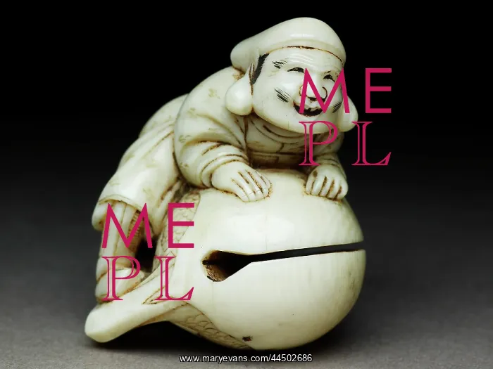  : Netsuke in the form of Daikoku climbing onto a mokugyo