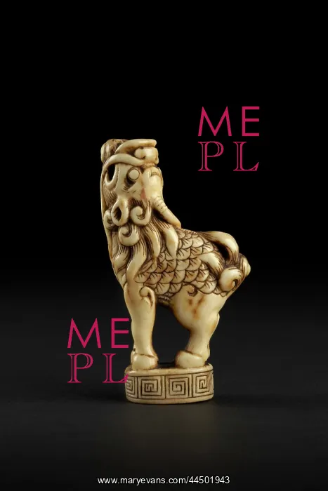 : Netsuke in the form of a kirin standing on a decorated base : Netsuke in the form of a kirin standing on a decorated base
