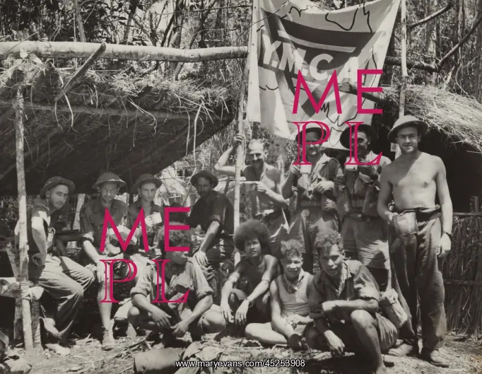 : New Guinean natives and Allied troops pause at : New Guinean natives and Allied troops pause at