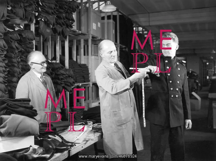 : New LFB recruit being measured for uniform : New LFB recruit being measured for uniform