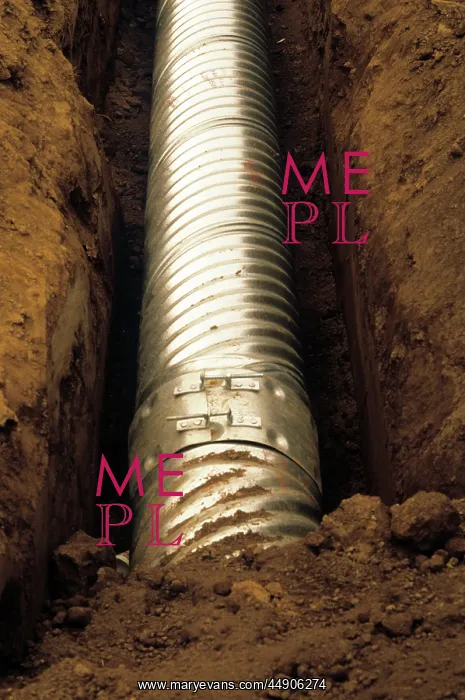 : Newly laid metal pipe in ditch
