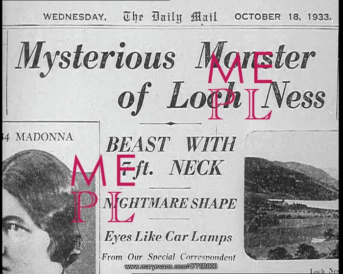 : Newspaper Headline Reading - Mysterious Monster : Newspaper Headline Reading - Mysterious Monster
