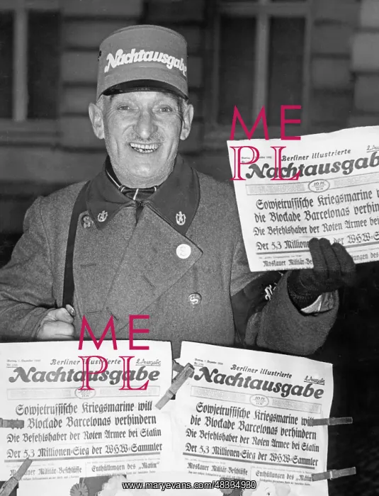 : Newspaperman with the late-night edition of : Newspaperman with the late-night edition of