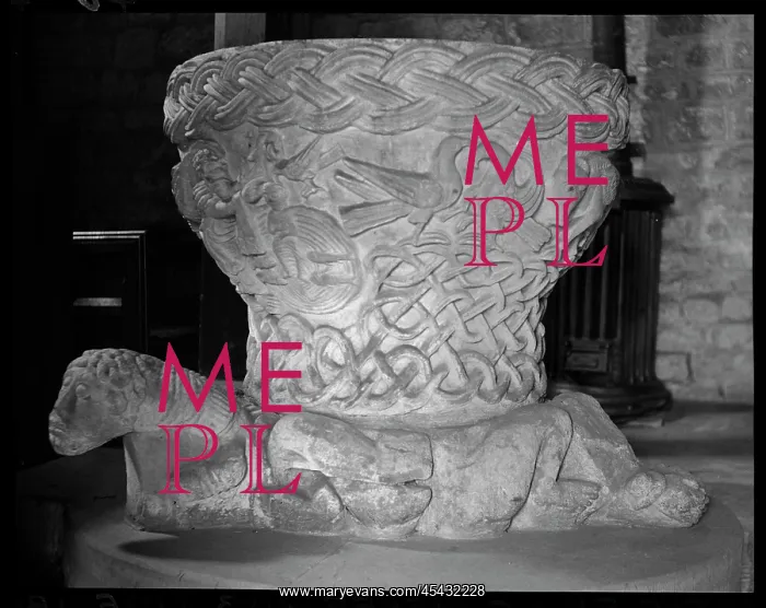 : Detail of a Norman font with three feet : Detail of a Norman font with three feet