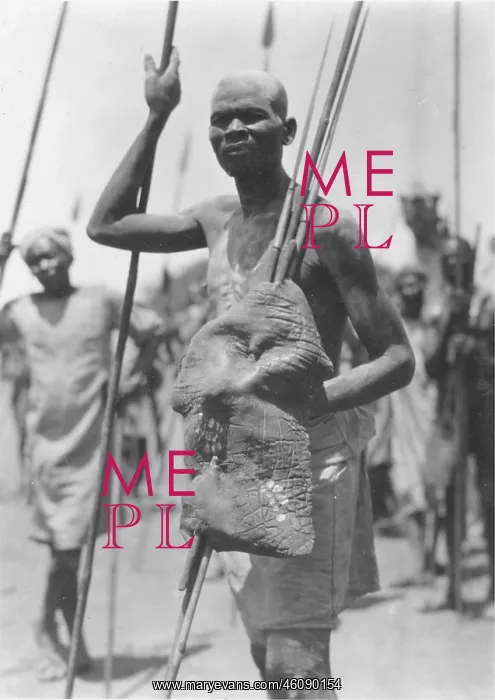 : Nuba warrior with shield made of elephant skin : Nuba warrior with shield made of elephant skin