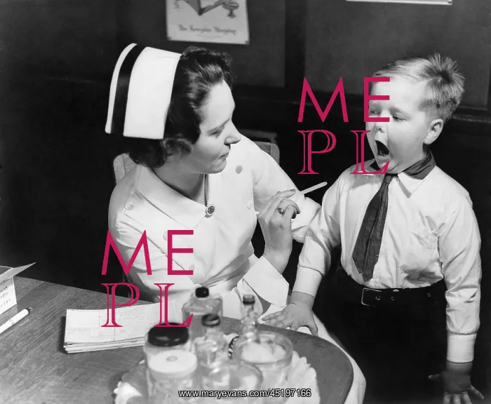 : A nurse examining the teeth of a boy in ? : A nurse examining the teeth of a boy in ?