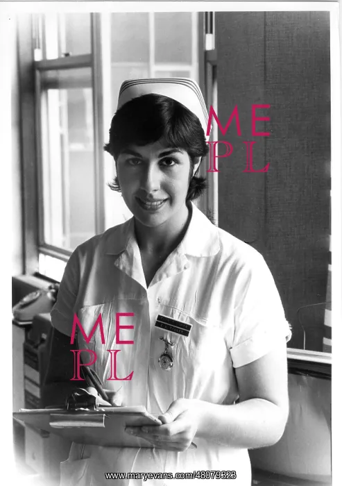 : Nurse holding a clipboard : Nurse holding a clipboard